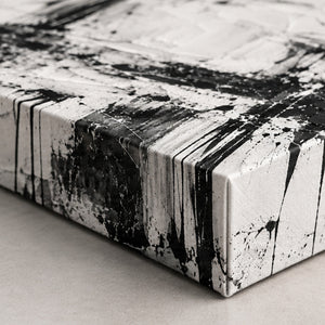 Detail view of Black and White Splatter Abstract Wall Art canvas and frame