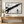 Black Brushstroke on Cream Abstract Wall Art styled in a living space
