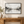 Monochrome Mountain Lake Reflection Wall Art styled in a living space