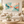 Teal and Coral Abstract Wall Art in a styled room